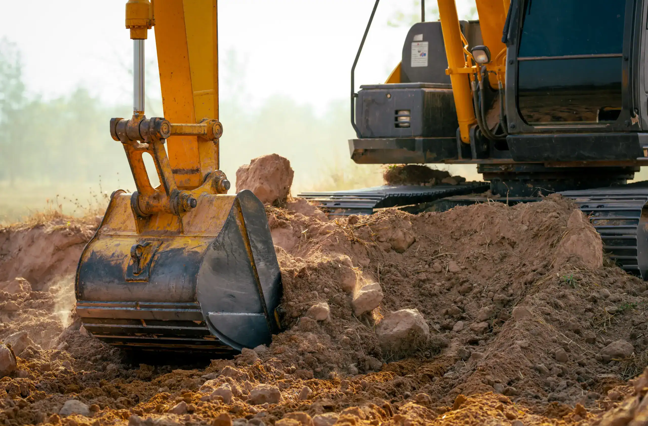 closeup-bucket-of-backhoe-digging-the-soil-at-cons-2025-01-29-07-44-34-utc
